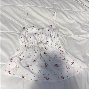 flowy white tank with red and yellow flowers